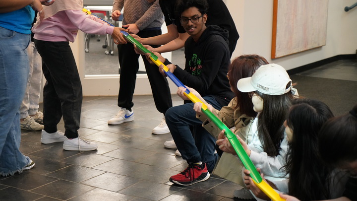Students working together to complete a challenge