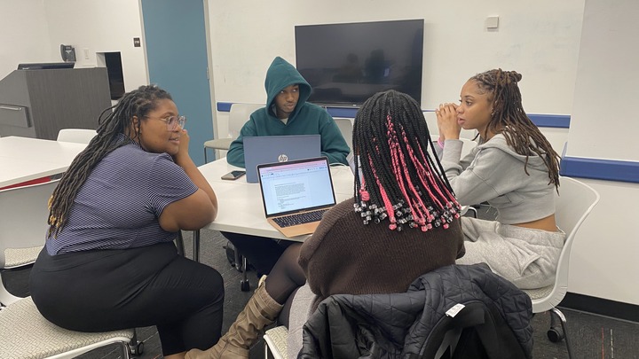Students working on a Zine
