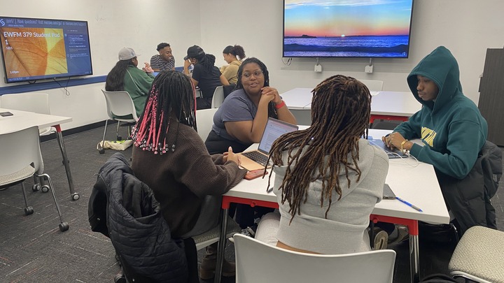 Students working on a Zine
