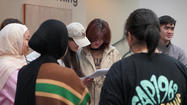 Students reading their challenge prompt