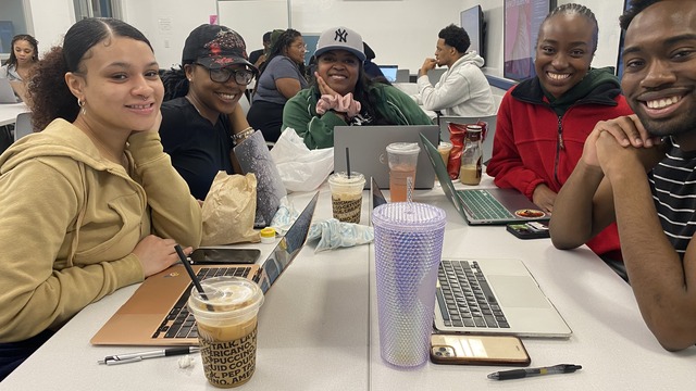 Students working on a Zine