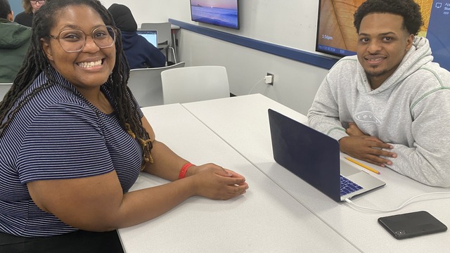 Students working on a Zine